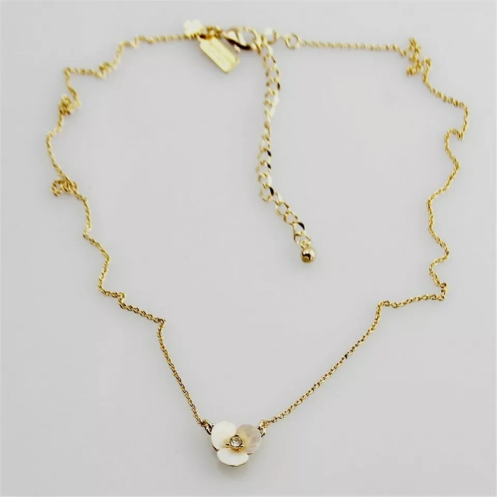 Kate Spade New York Gold Tone Disco Pansy Disco Mother of Pearl Necklace.